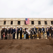Picture of VA team shoveling dirt at construction site for groundbreaking ceremony