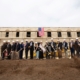 Picture of VA team shoveling dirt at construction site for groundbreaking ceremony